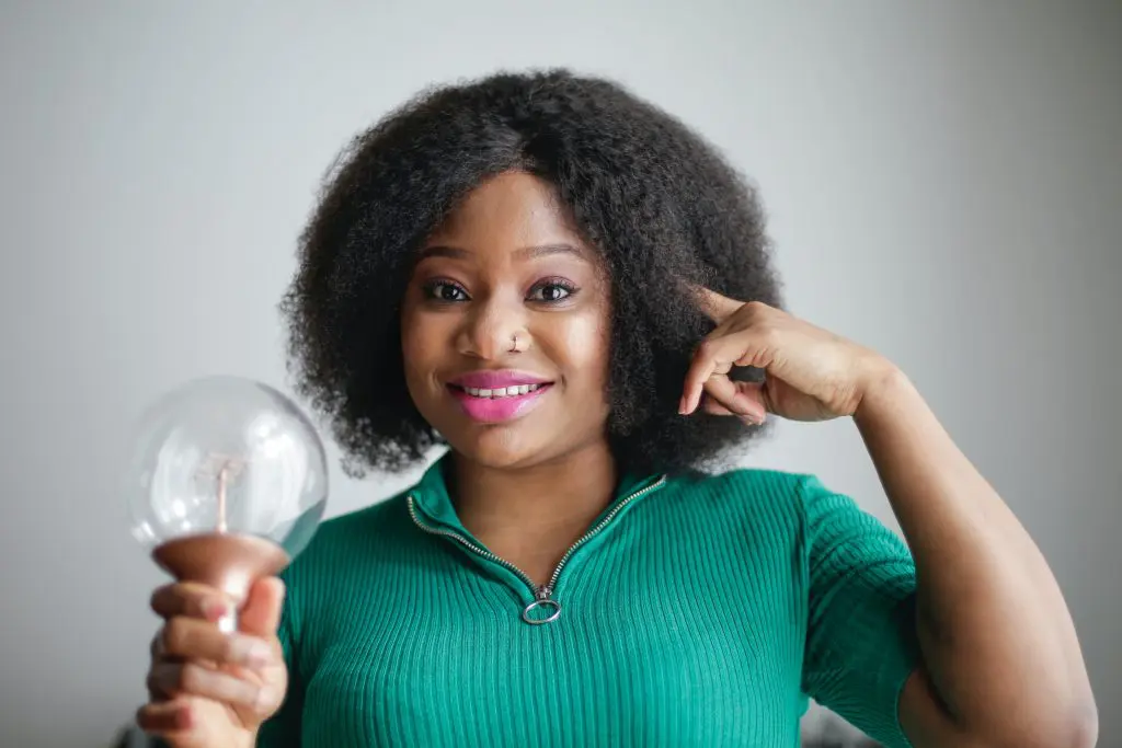 A women is holding a bulb