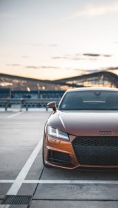 Brown car parked at sunset