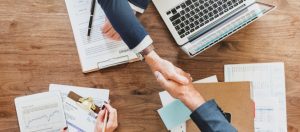 Two customers shaking hands