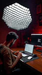 A software developer coding on a laptop