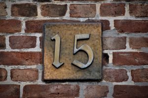 Number 15 on a brick wall